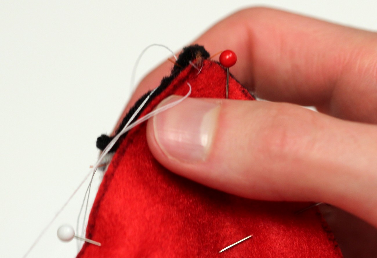 52 - hand stitch mouth piece to face