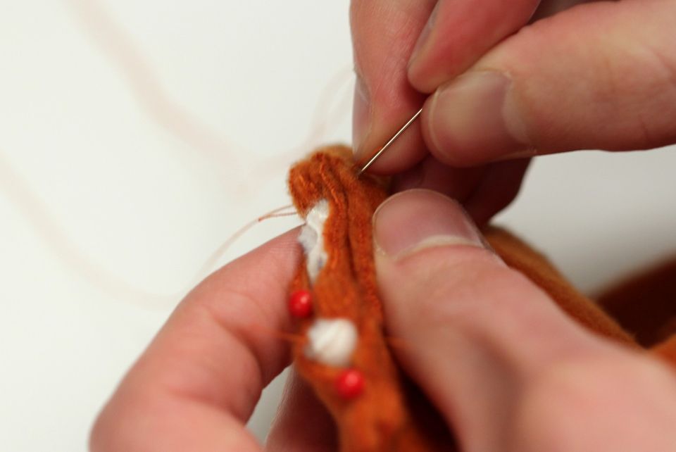 40 - stitch ear in place
